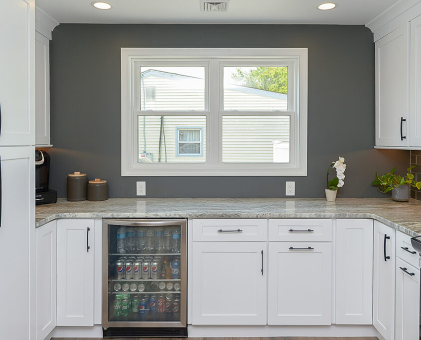 Sleek kitchen remodel, white cabinets, natural lighting