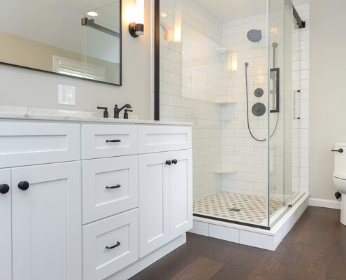 Master bathroom remodel, wooden floors, white counters, shower stall