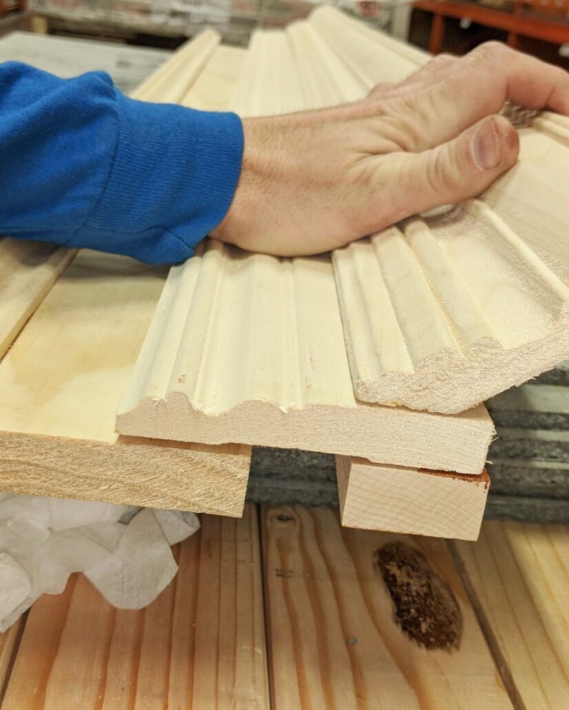 Ayars craftsman shapes wood for a fireplace mantel